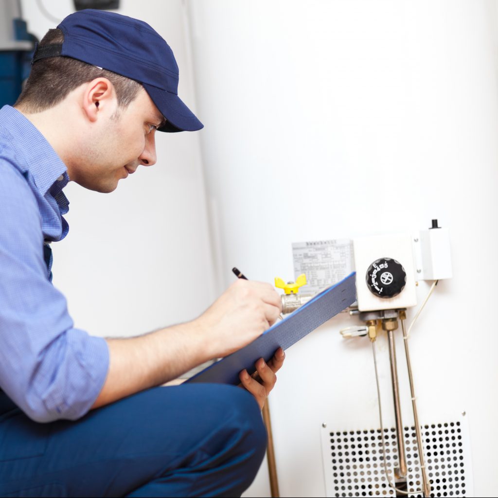 Technician Testing Water Heater