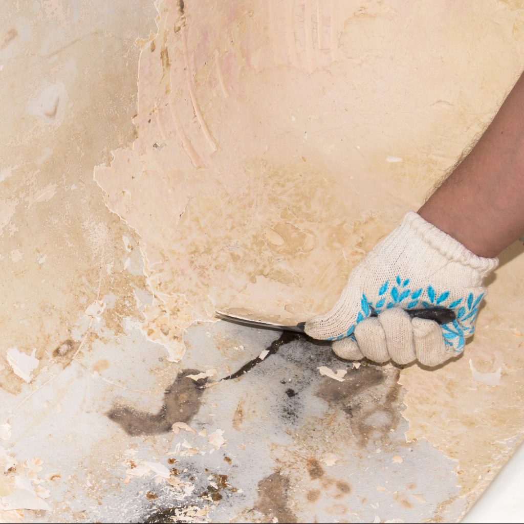 Man Repairing Water Damage