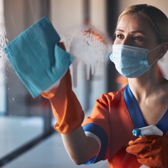 Woman cleaning window